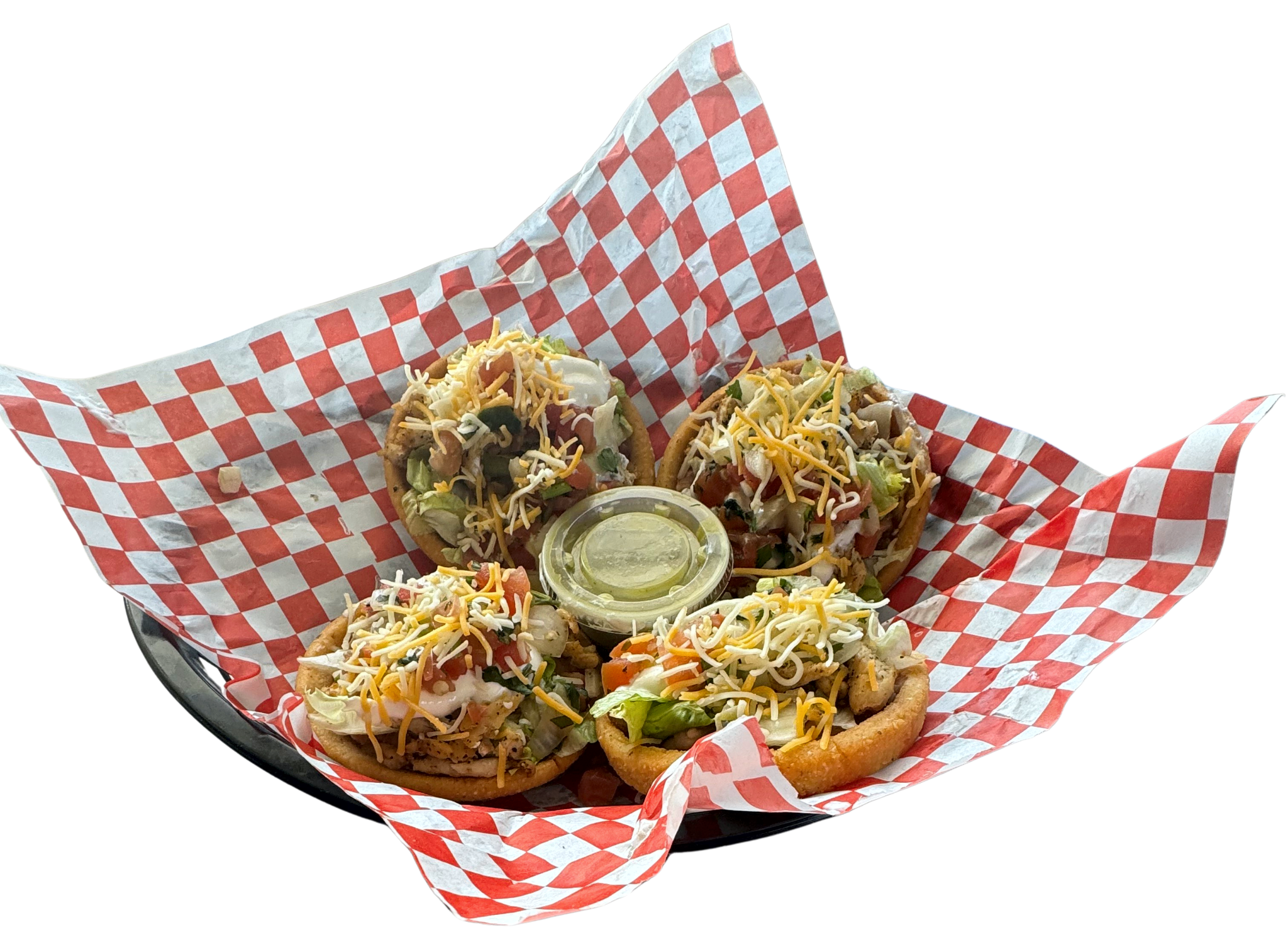 Sopes with meat, beans, lettuce, cream, and cheese